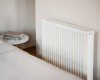 Voorbeeld van een Thermify elektrische radiator in een werkkamer. Getoond model: Elektrische radiator 1300 Watt.